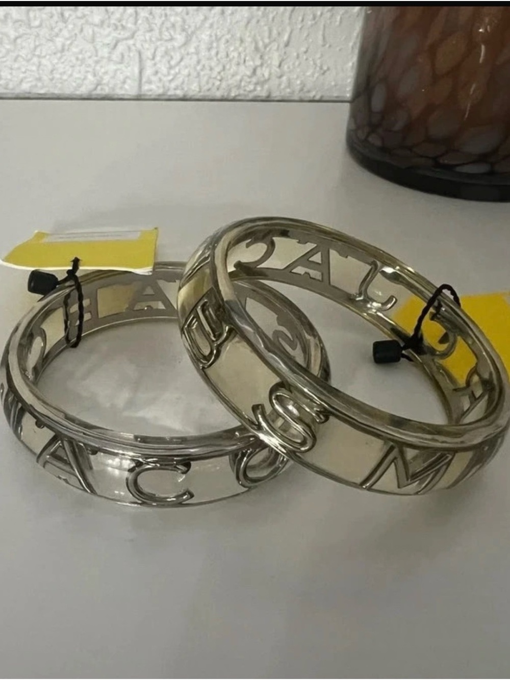 A pair of Transparent Monogram Openwork Cutout Bangles